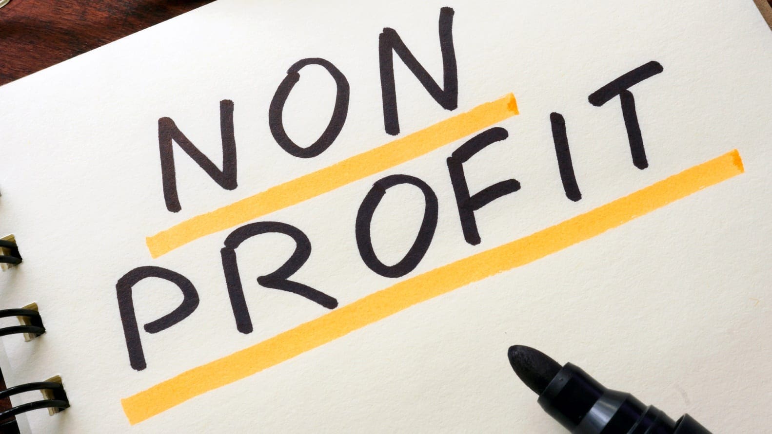 word non-profit written on paper in marker