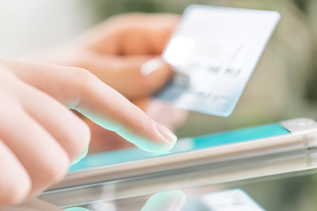 person making online purchase with credit card