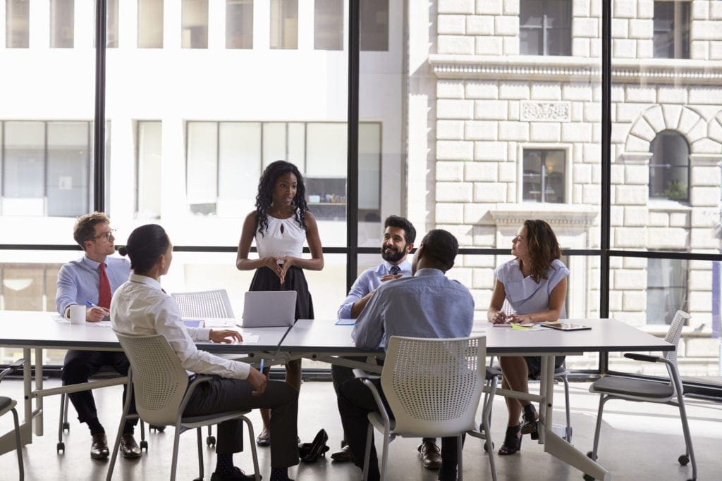 Young woman discusses AP automation solutions during meeting