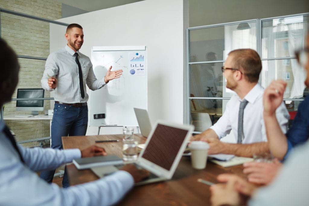 Professional man presenting to small group