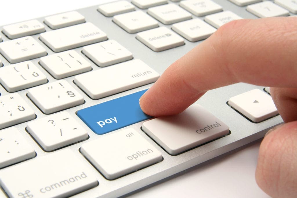 computer keyboard with blue pay button