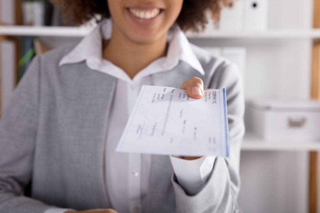 Woman with paper check