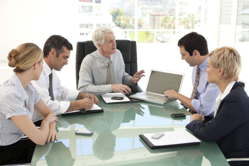 group of business professionals in a meeting setting