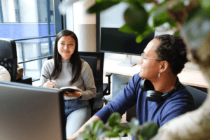 man and woman working in office