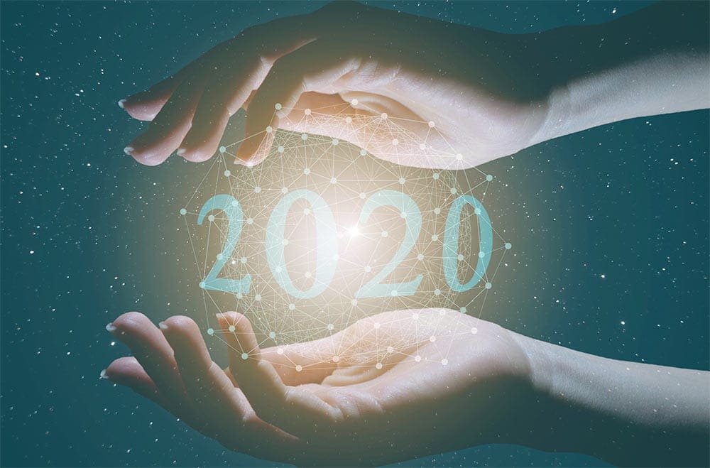 hands holding the number 2020, used to communicate technology trends for 2020