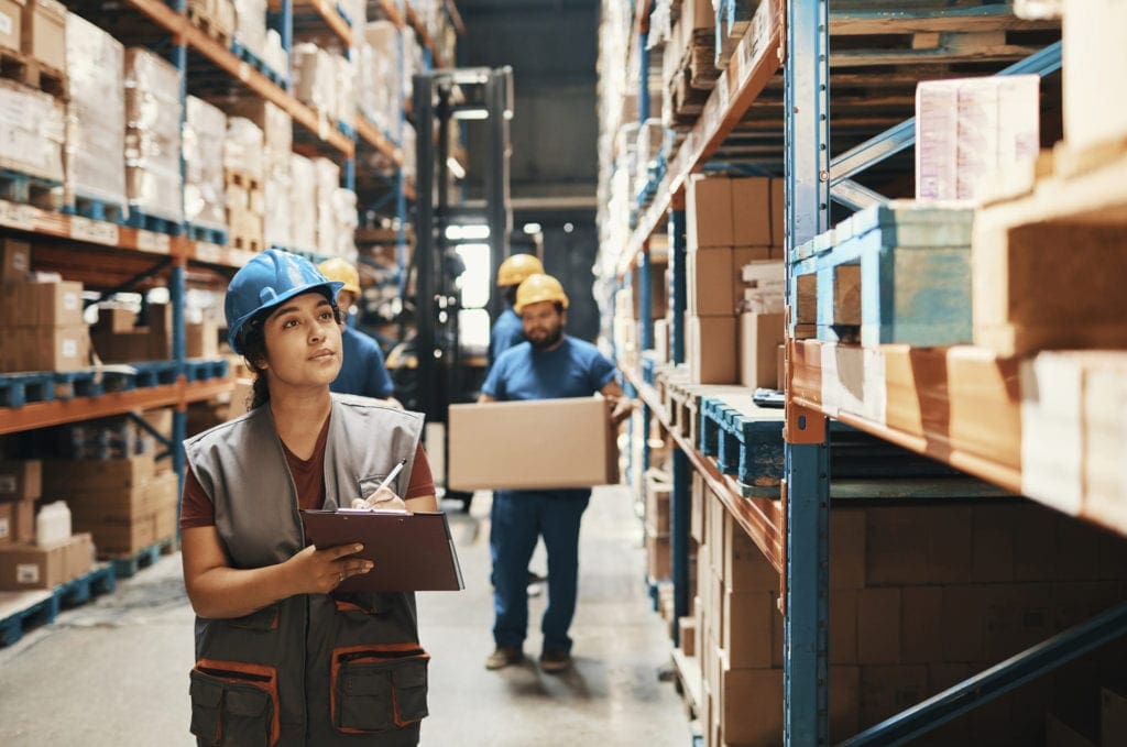 Close up of a group of workers working in a warehouse, used by AvidXchange for article about how automation supports supplier payments in times of crisis