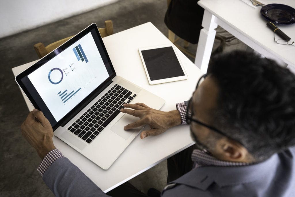 High angle view of a businessman using laptop