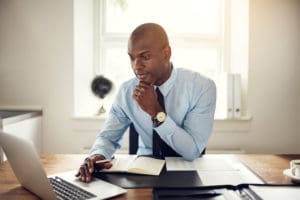 Man focusing at desk