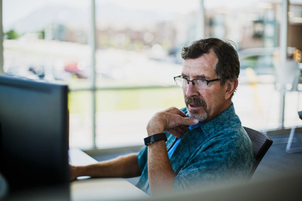 Man working on a laptop.
