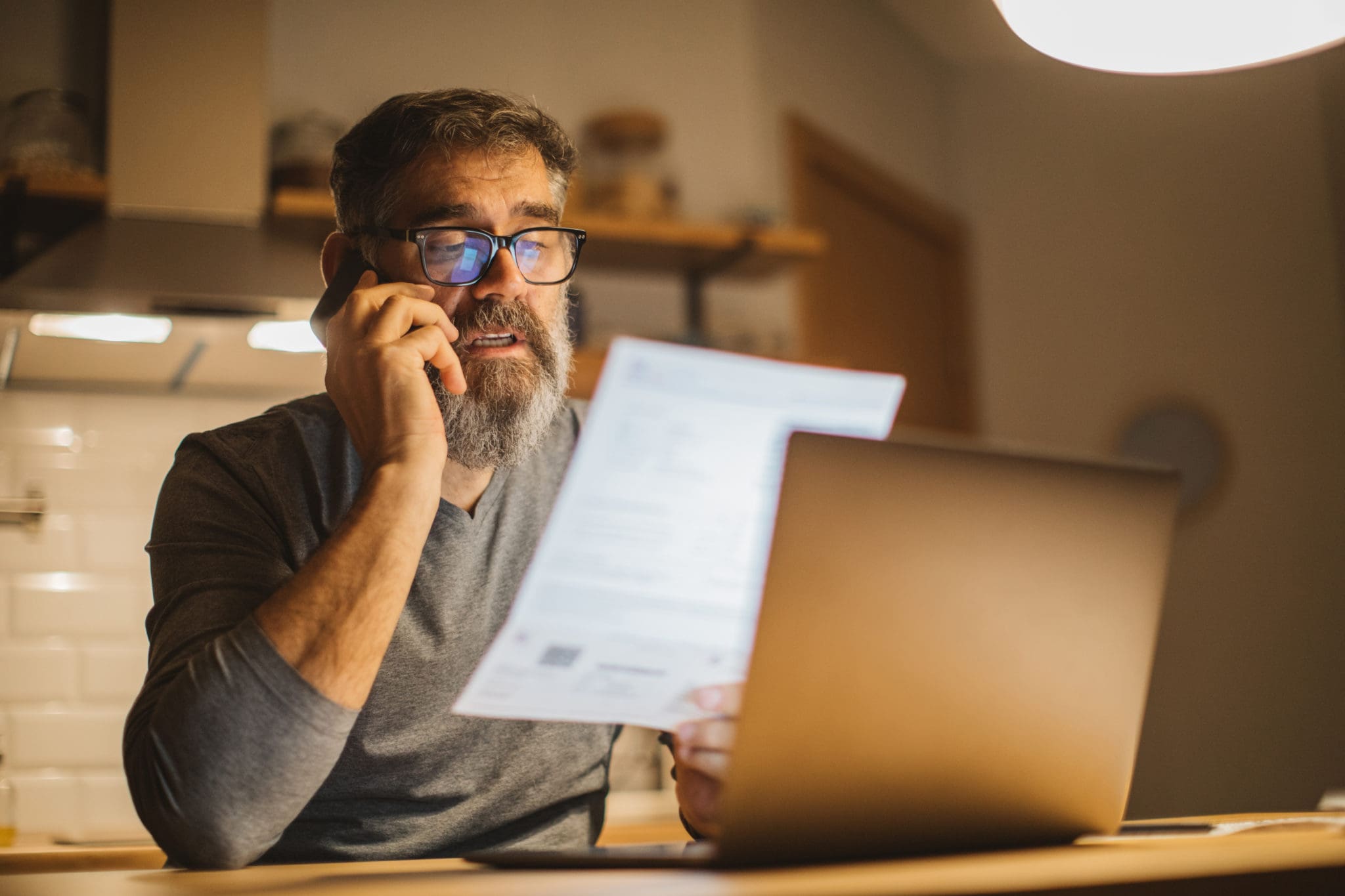 Man looking at invoice