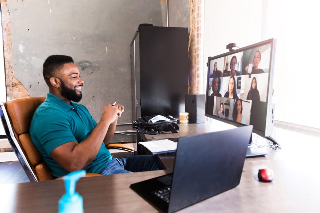 Man videoconferencing from home