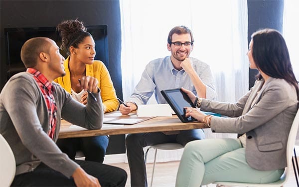 co-workers meeting at a table
