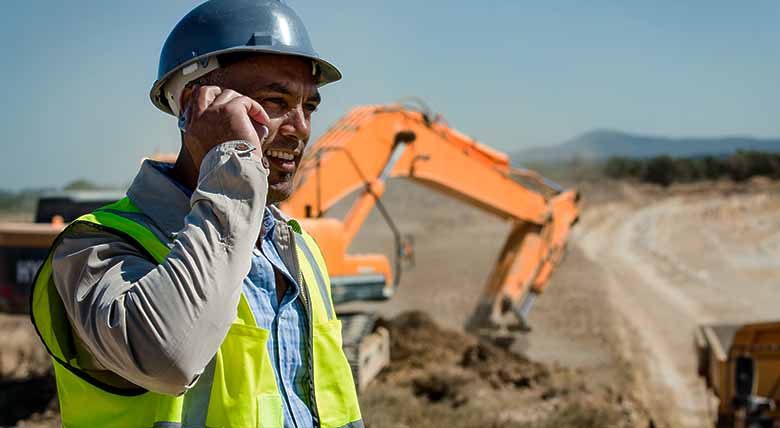 Construction worker talking on phone
