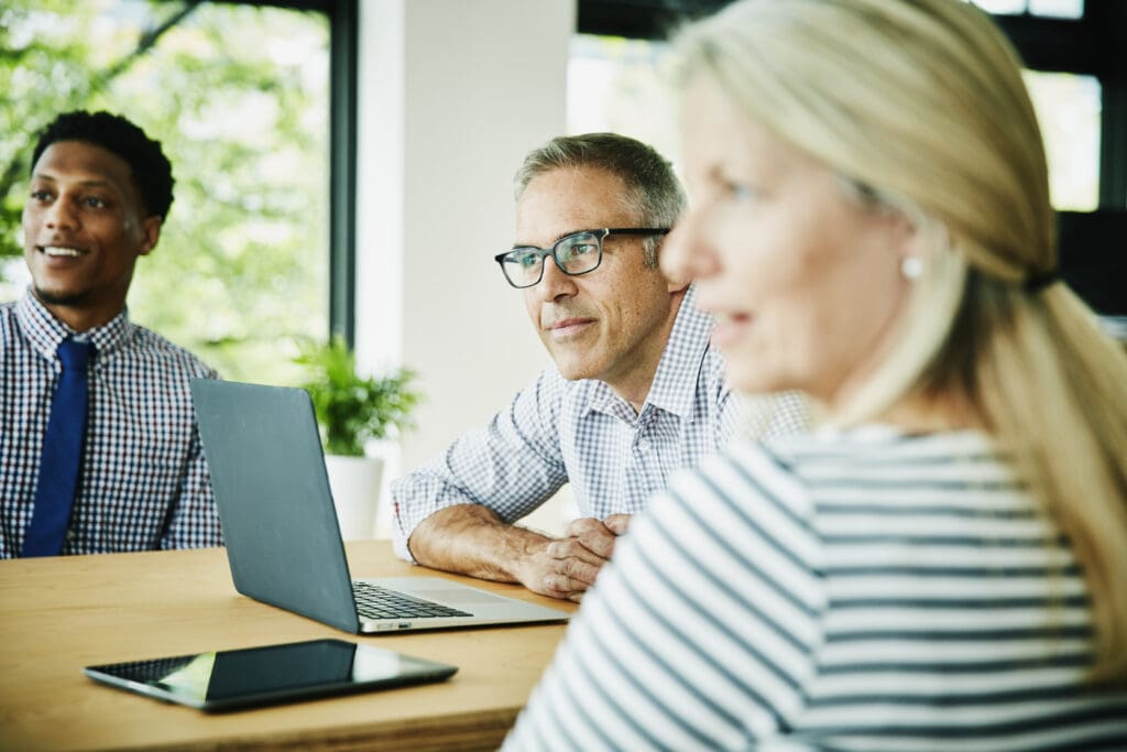 Colleagues listening during client presentation regarding AP automation solutions