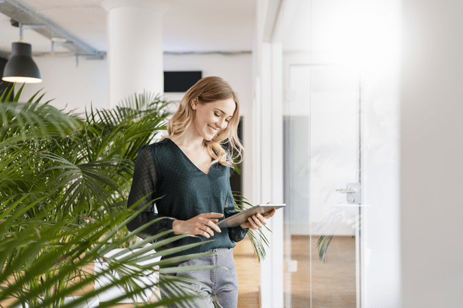 woman looking at template in an office