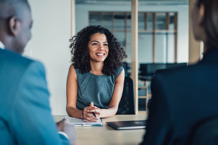 Real estate professional sitting in a meeting