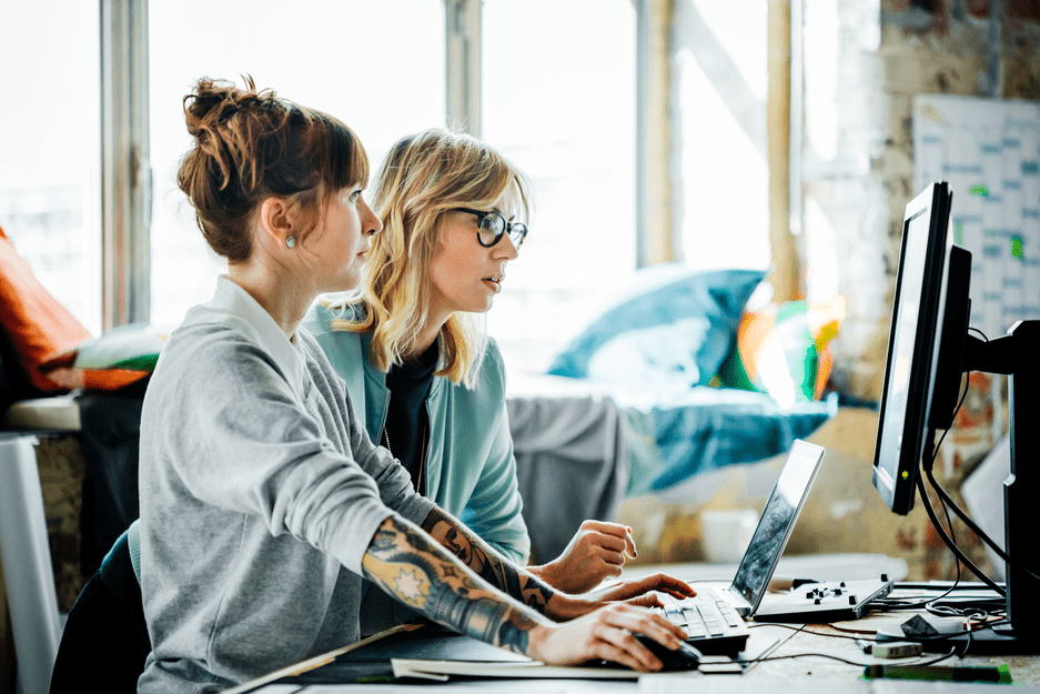 Two women working in office