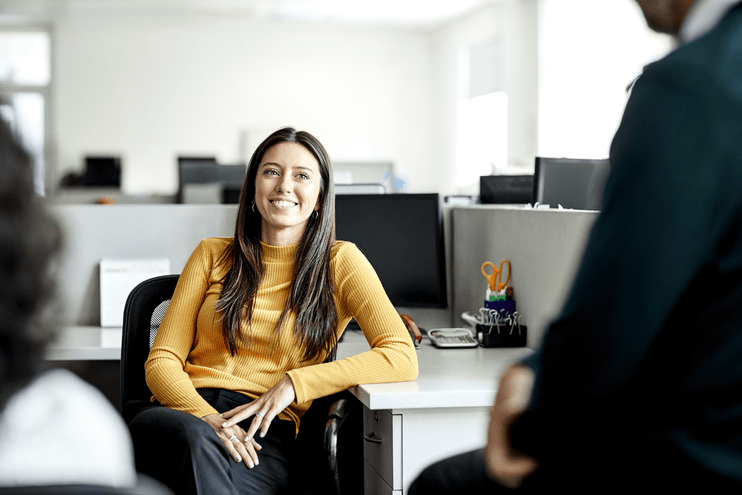woman sitting in cubicle