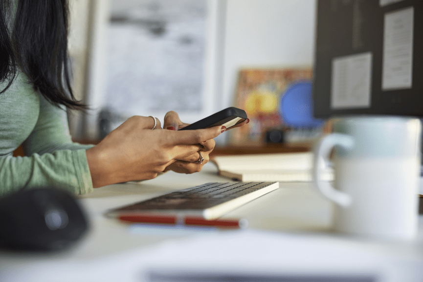 woman working on mobile phone