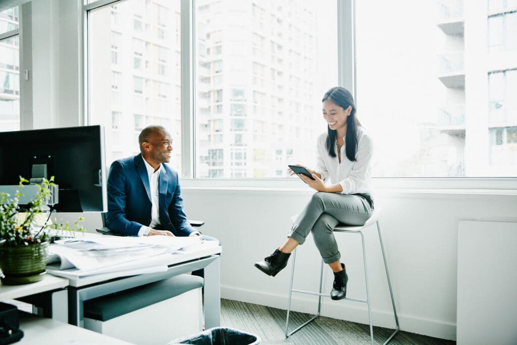 Businesswomen talking about a deal with a colleague