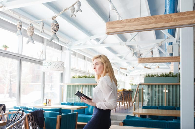 Hotel manager working on a mobile device