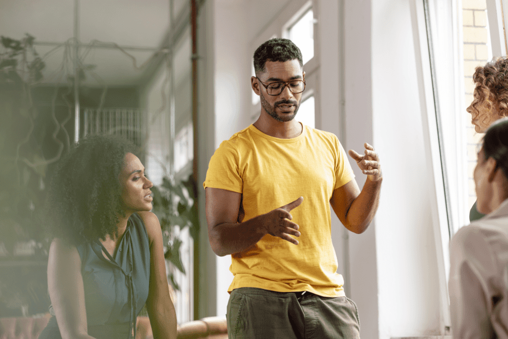 Man and woman talking at work