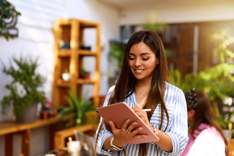 Woman working on tablet in office