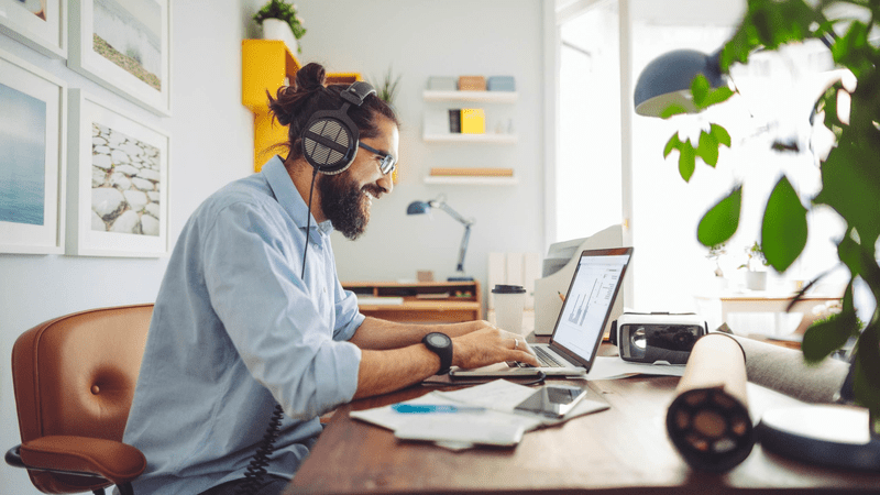man working at home on laptop
