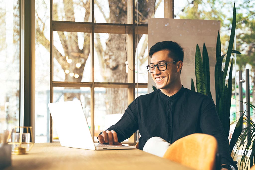 Young Asian entrepreneur is doing a video call conference at a public office