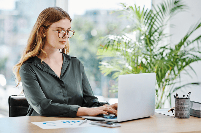 woman typing on laptop