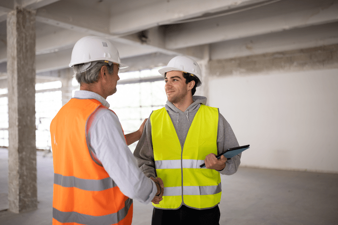 construction professionals with a tablet