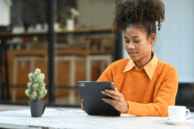 woman at tablet working at desk