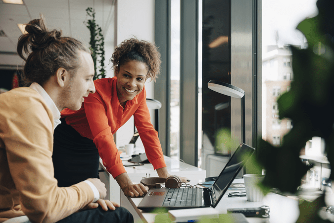 man and woman collaborating at work