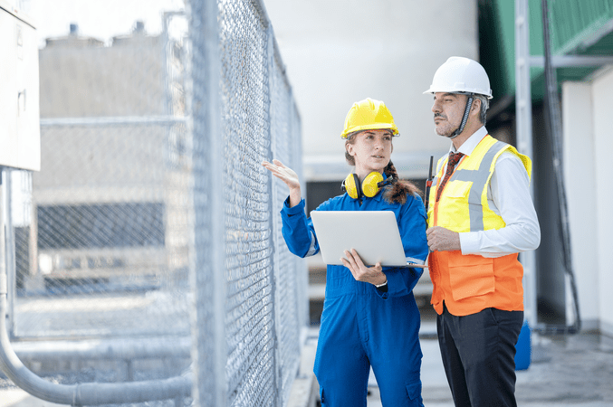 man and woman on construction site