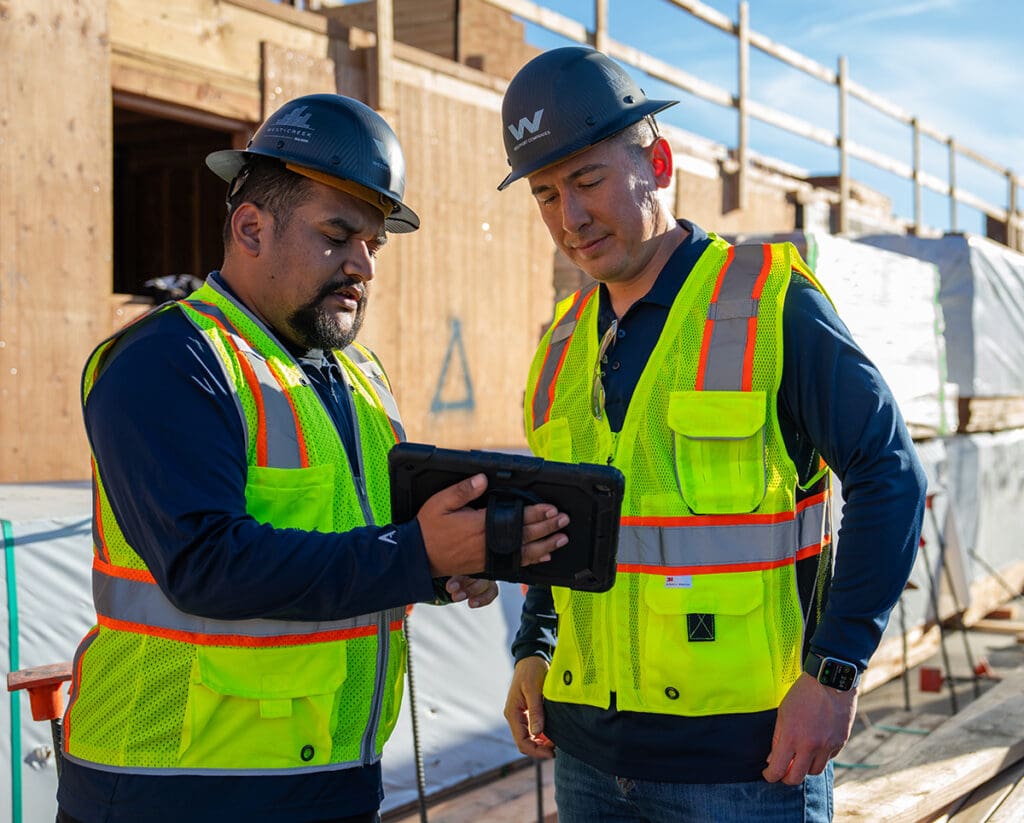 Two Westport construction workers on a job site.