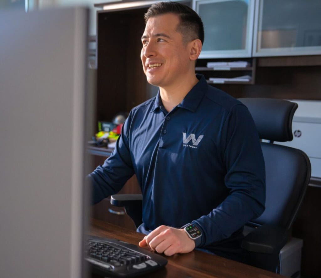 Westport Construction employee working at his desk.