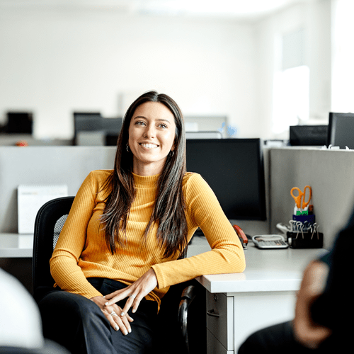 woman sitting at work desk