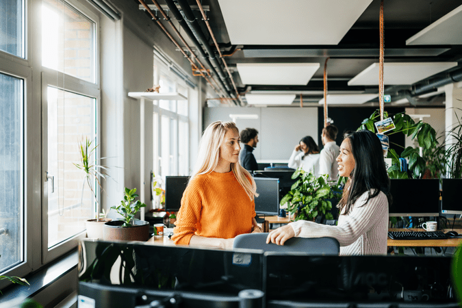 women chatting at work