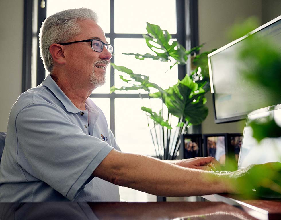 Carolina Asthma & Allergy Center employee at his desk.
