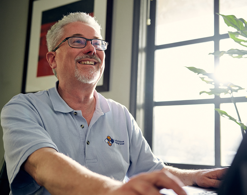 Carolina Asthma & Allergy Center employee at his desk.