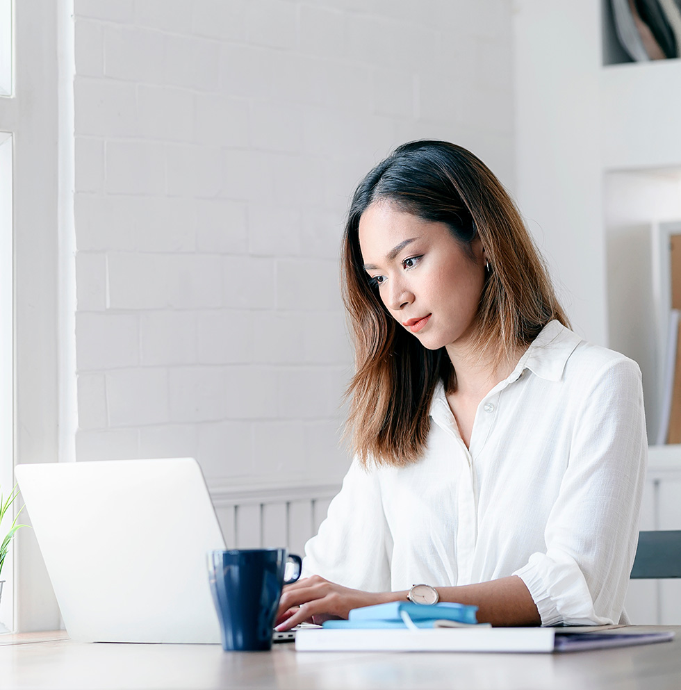Woman concentrating working on her laptop.